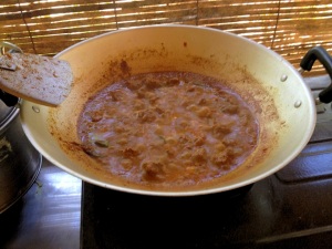 The delicious beef rendang bubbling away on the stove